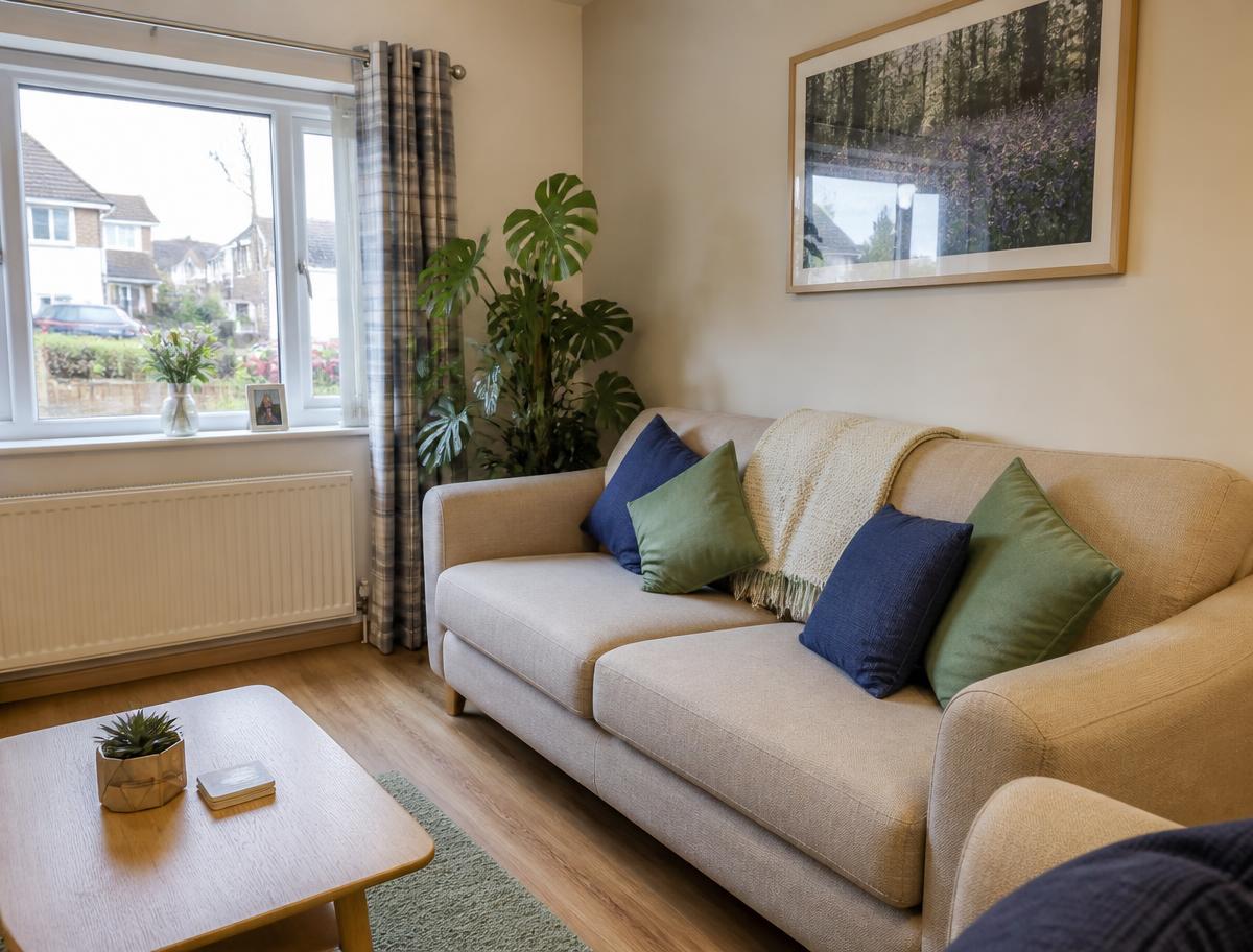A bright, homely shared living room in a supported living house